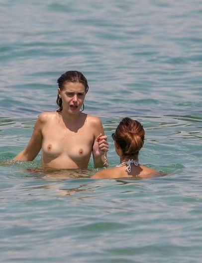 Barbara Opsomer Sunbathing Topless On A Beach