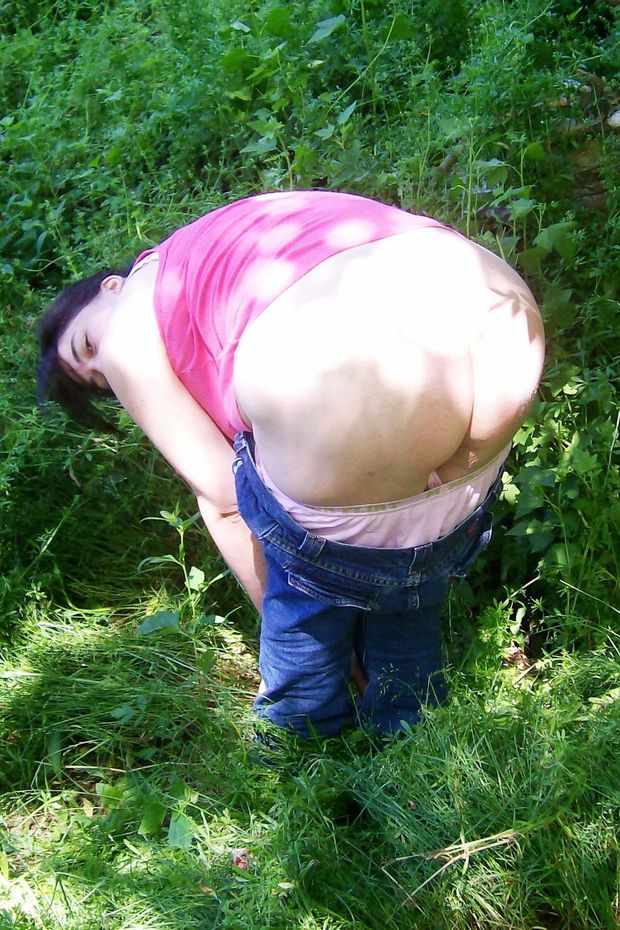 Mercy pulling her pants down for an outdoor spanking