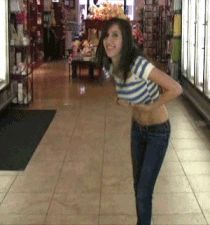 Sexy brunette flashing in a store