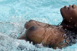 Great ebony breasts floating in the pool