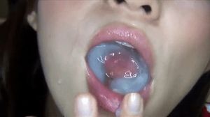 she has fun swirling her tongue in the sperm that fills her mouth