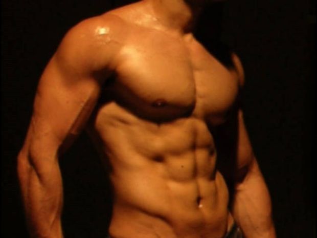 Muscular gay man in a sexy pose