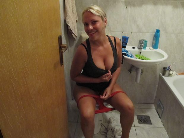 blonde milf looking sexy on toilet