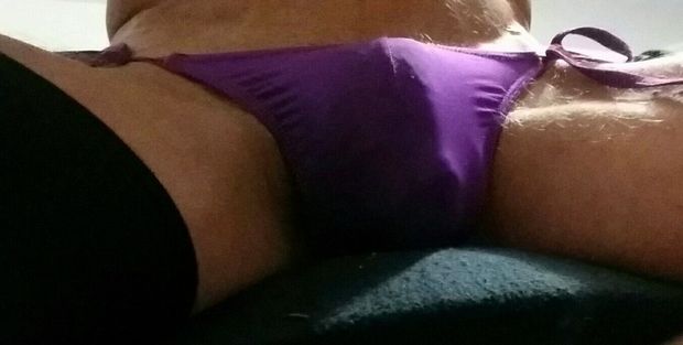 My purple tie side knickers straining a little as my cock getting a little exited