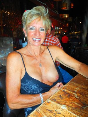 Flashing a tit in a bar