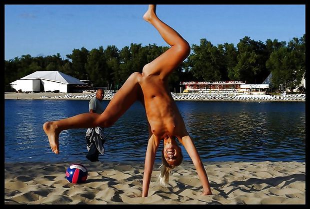 Happy  naked gal at the beach