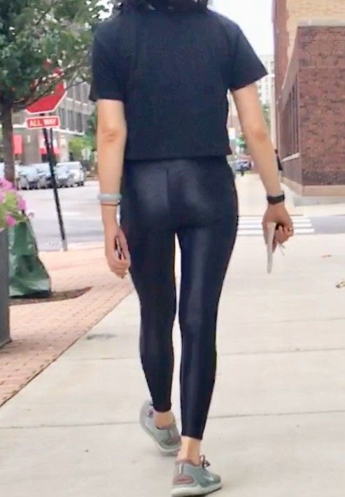 Asian teen in shiny leggings