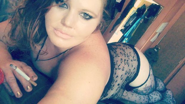 Smoking in sexy fishnets and ready to pound my creamy wet pussy
