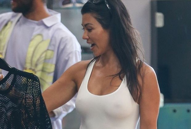 Braless celeb Kourtney Kardashian hard nipples in public