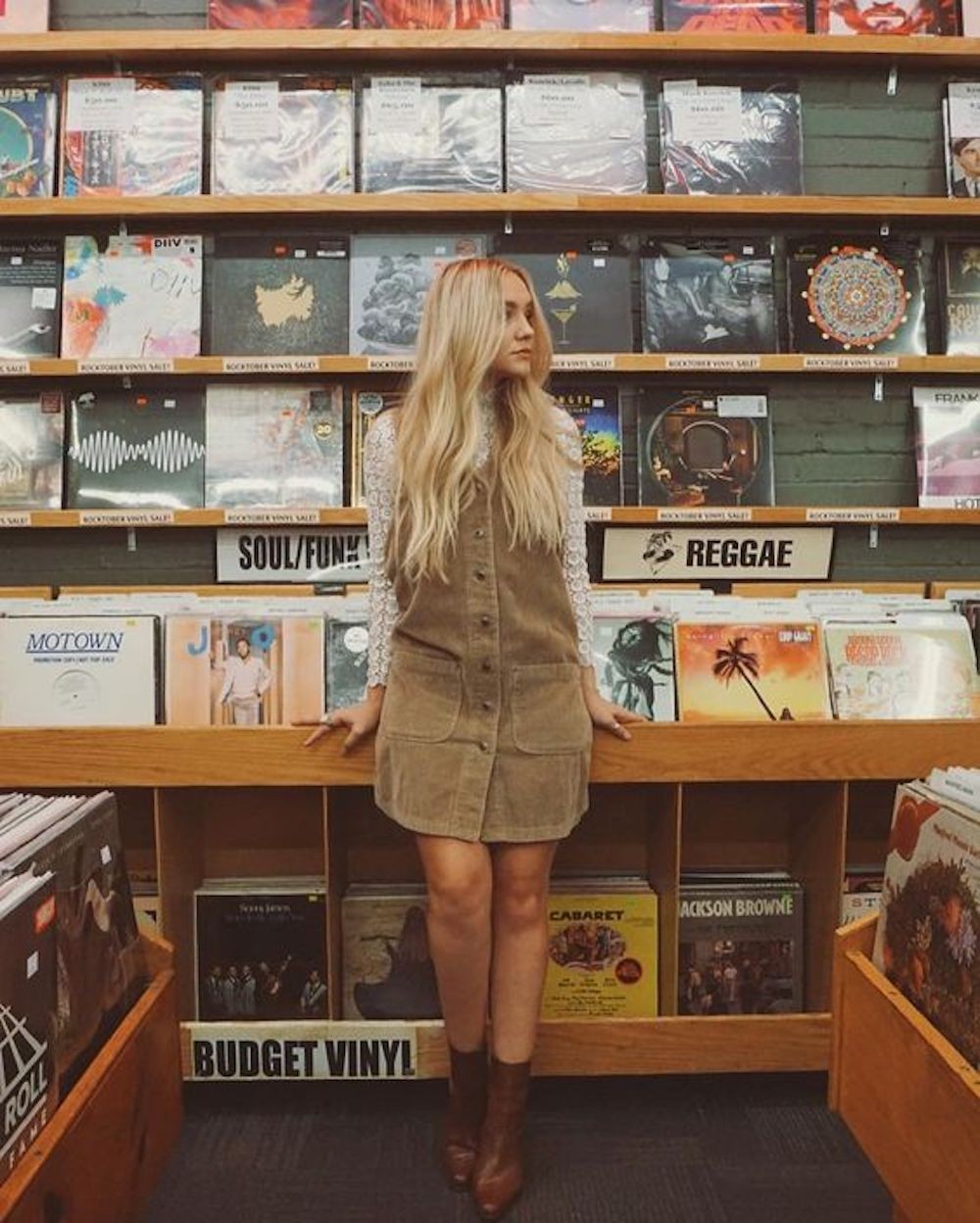Beautiful grrrl in a record store
