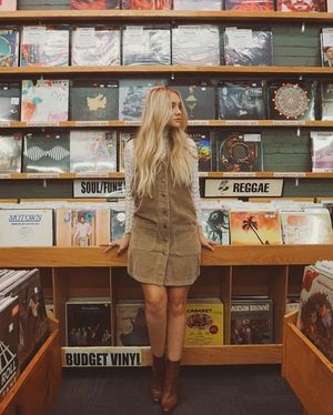 Beautiful grrrl in a record store