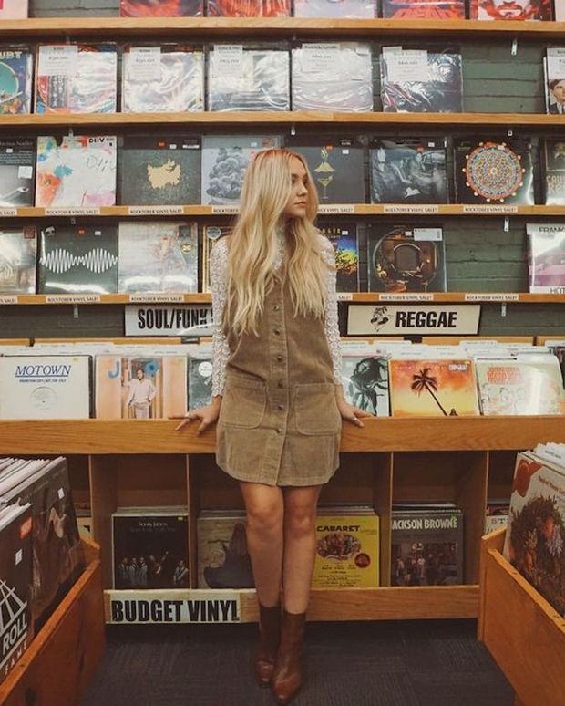 Beautiful grrrl in a record store