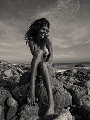 Brooke Burke topless on a beach