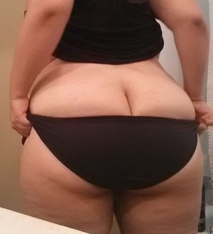 As she slides her knickers down over her fat arse, your cock feels like it's about to BURST!