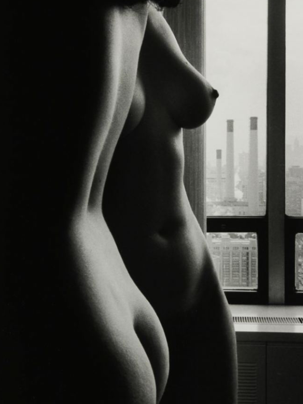 Two women bathed by window light.