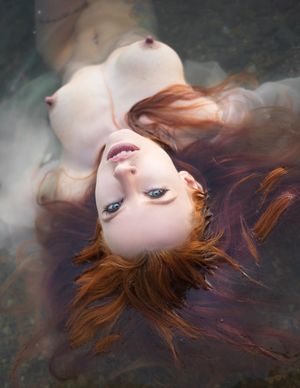 Long flowing hair, beautiful body in ethereal setting