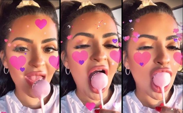 Nilsa licks lollipop