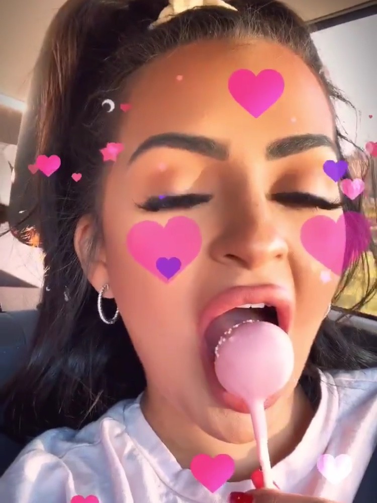 Nilsa licks lollipop