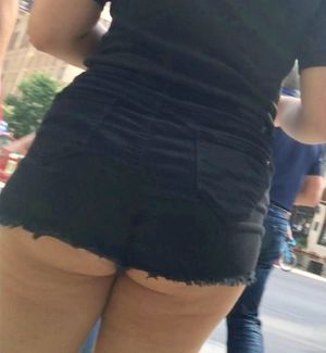 Thick Teen ass hangs out of shorts