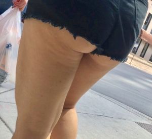 Thick Teen ass hangs out of shorts
