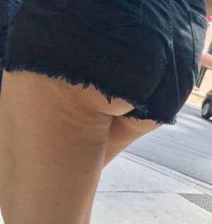 Thick Teen ass hangs out of shorts