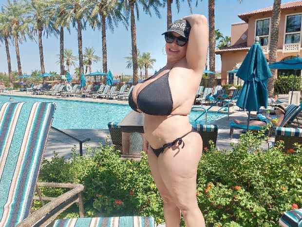 Flesh oozing everywhere from plump Claudia Marie in a bikini at Lake Las Vegas