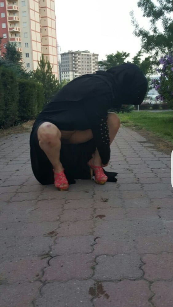 a perfect muslim slut flashing in the street like all hijab whores walking around naked under that black abya