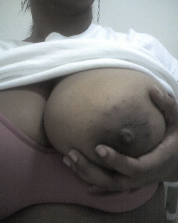 Holding those Huge Tits
