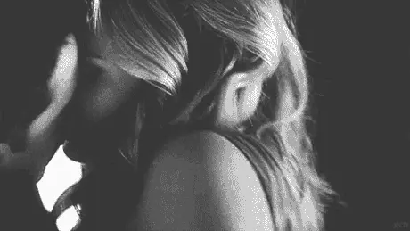 Blonde Woman Passionately Kissing Her Man