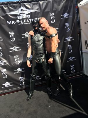 He's checking out my hard rubber-sheathed cock