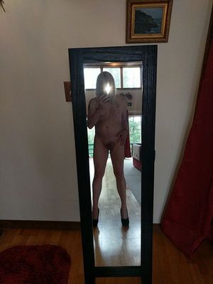 Shemale Janey standing naked in high heels