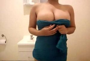Asian babe with huge boobs teasing