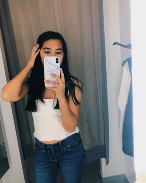 Sexy Asian in almost see through white shirt and sexy hips