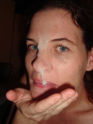 Her eyes are looking right at you. Thick cum running down her face. She knows the effect it has on you and what you are doing.