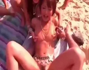 Asian  Squirting On A Beach