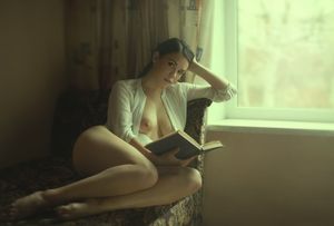 Sexy brunette reading book