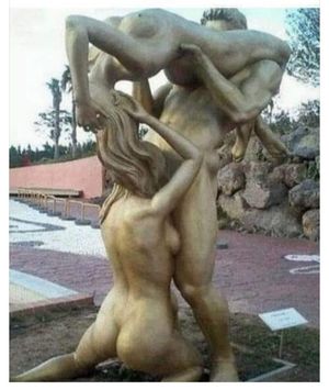 Threesome statue with two woman and one man licking together