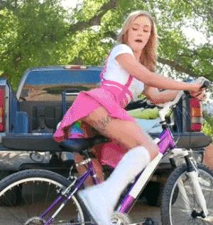 Teen Riding Her Bike With Rainbow Dildo On The Seat