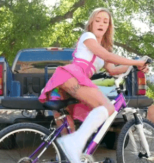 Teen Riding Her Bike With Rainbow Dildo On The... - MeStrip
