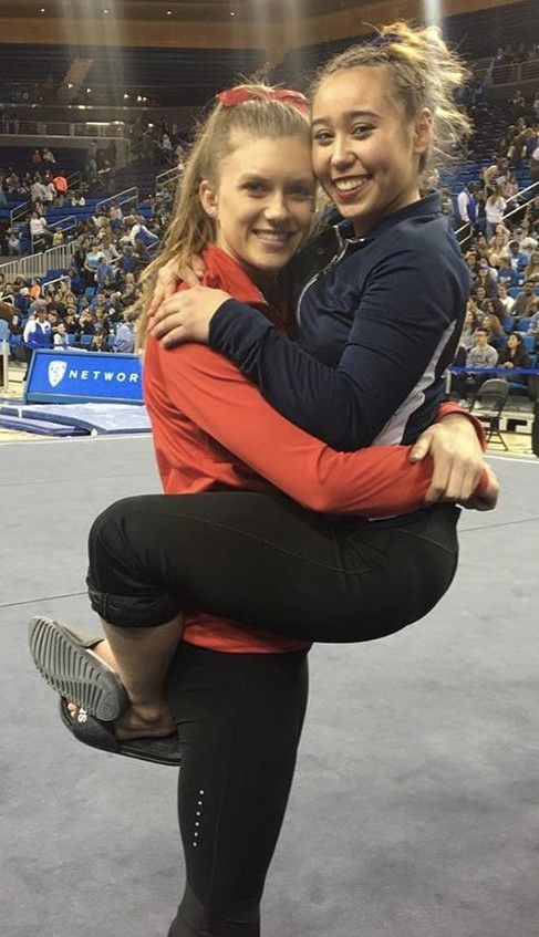 Katelyn Ohashi hangs on to team girlfriend