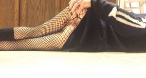 Showing off ass and pussy in fishnets