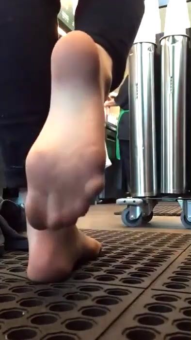 Barista tease shows off her pantyhose feet