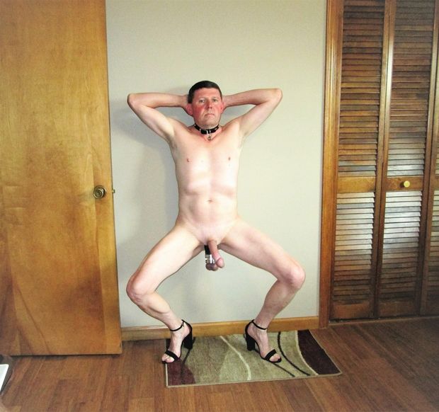 submissive collared sissy slut squating with ball weights and heels hands behind head