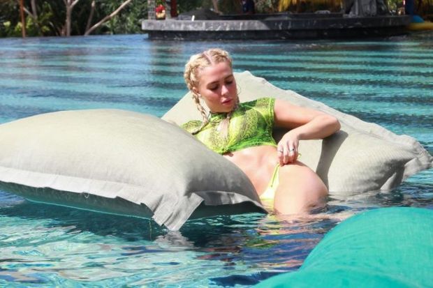 Gabby Allen sexy ass in a thong bikini on vacation in the water and showering off showing off her body seen by paparazzi.