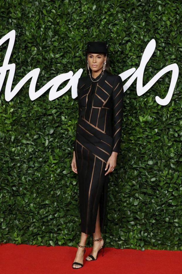 Cindy Bruna nip slip wardrobe malfunction braless in a see through dress photographed by paparazzi arriving to The Fashion Awards.