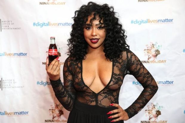 B. Simone braless boobs in a see through top showing off her big tits and nice cleavage photographed on the red carpet.
