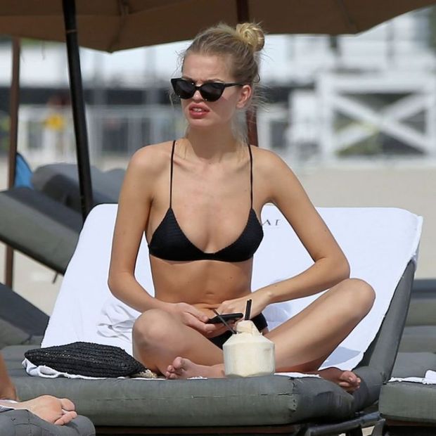 Daphne Groeneveld in a sexy little black bikini seen at the beach by paparazzi showing off her dutch model body.