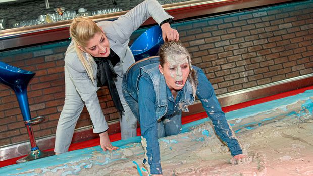 Bitchy boss wrestles brunette employee and gets caked in mud