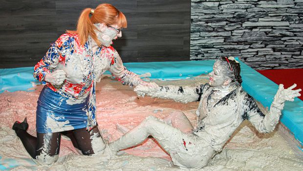 Naughty babe in uniform has a messy mud wrestling match with her female teacher