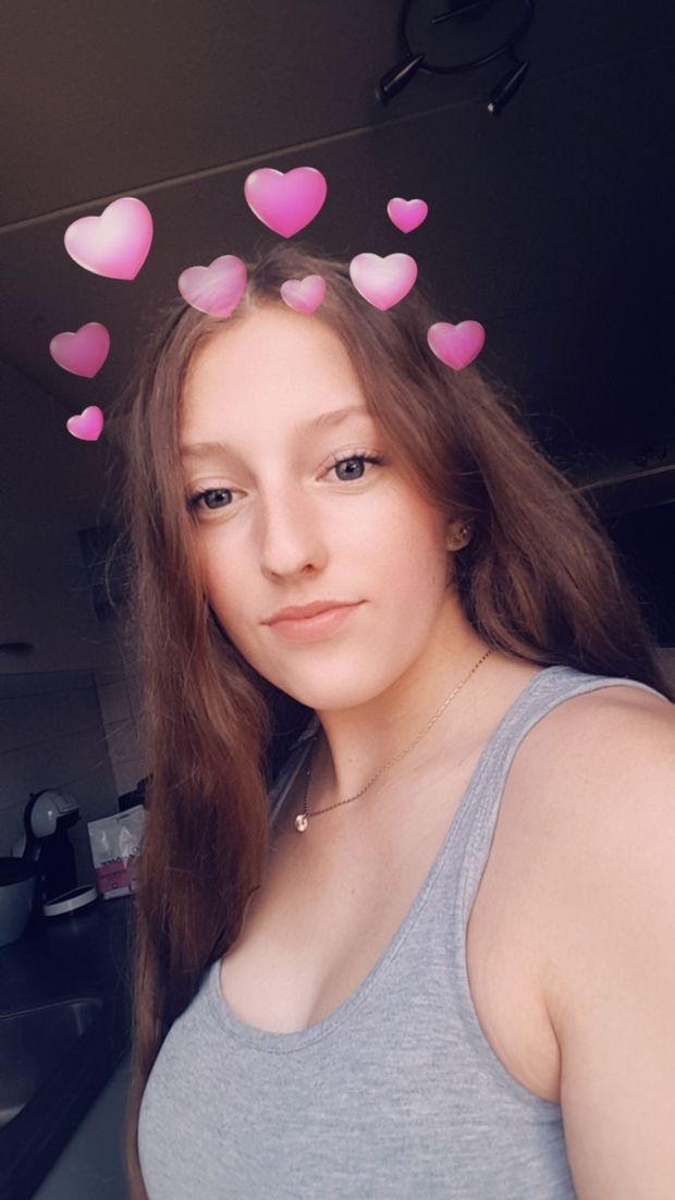 Cute looking teen with large boobs